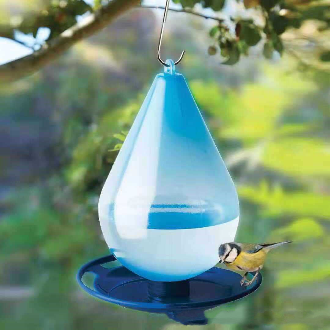 Comedero para pájaros con gancho para colgar.